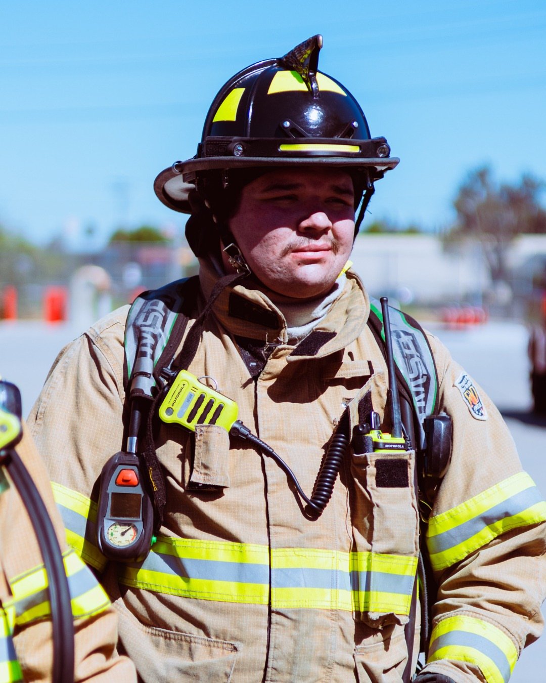 satisfied client with fire fighter helmet